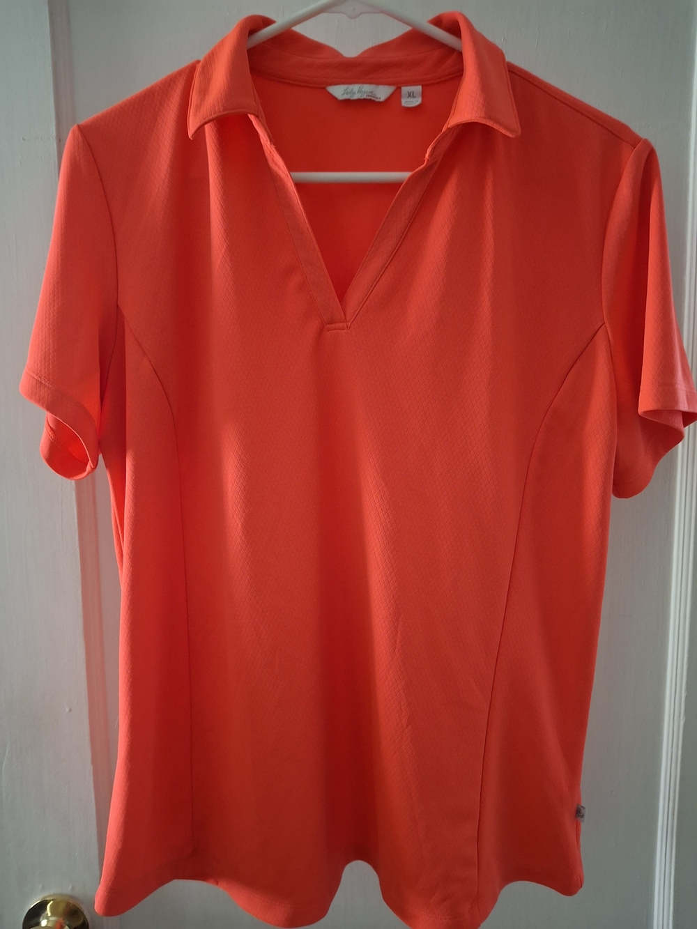 Lady Hagen Short Sleeve Polo Top in Bright Coral